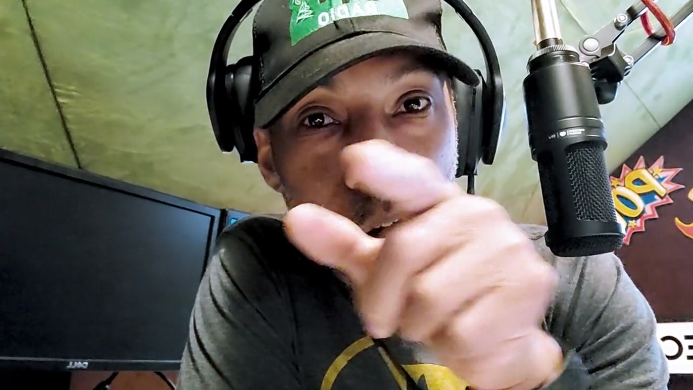 Frame from BYLR Radio showing a host on camera at the microphone